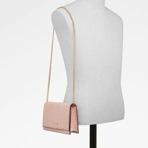 ALDO light pink faux skin clutch - blemish on back
